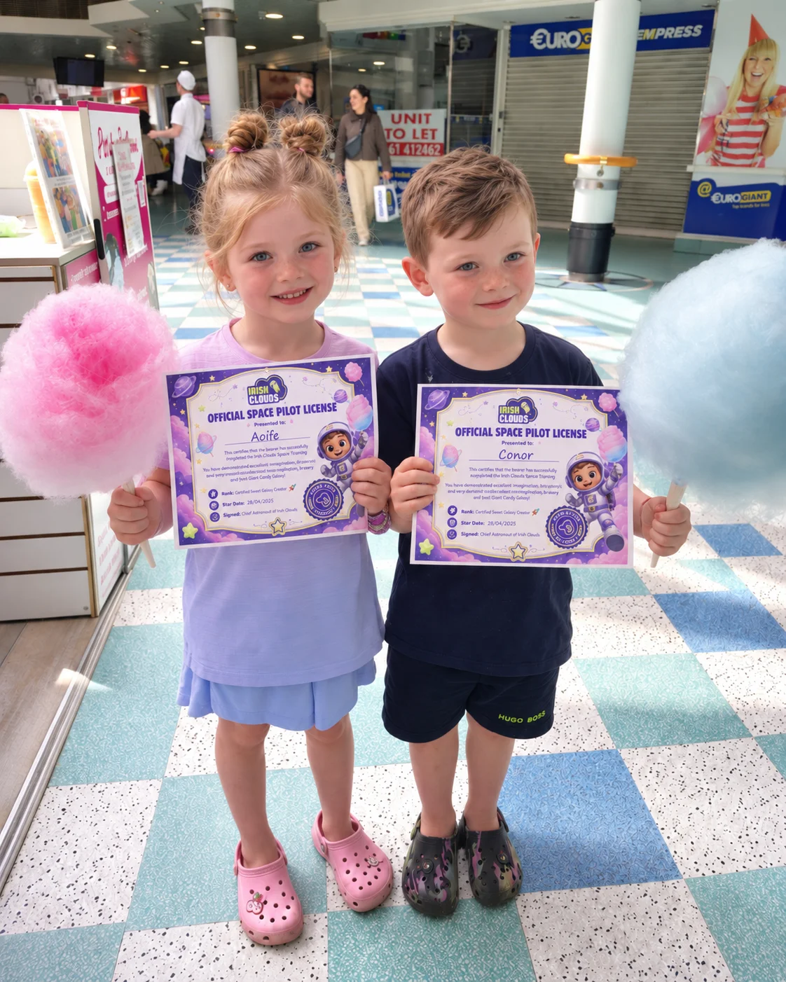 Children holding Irish Clouds certificates