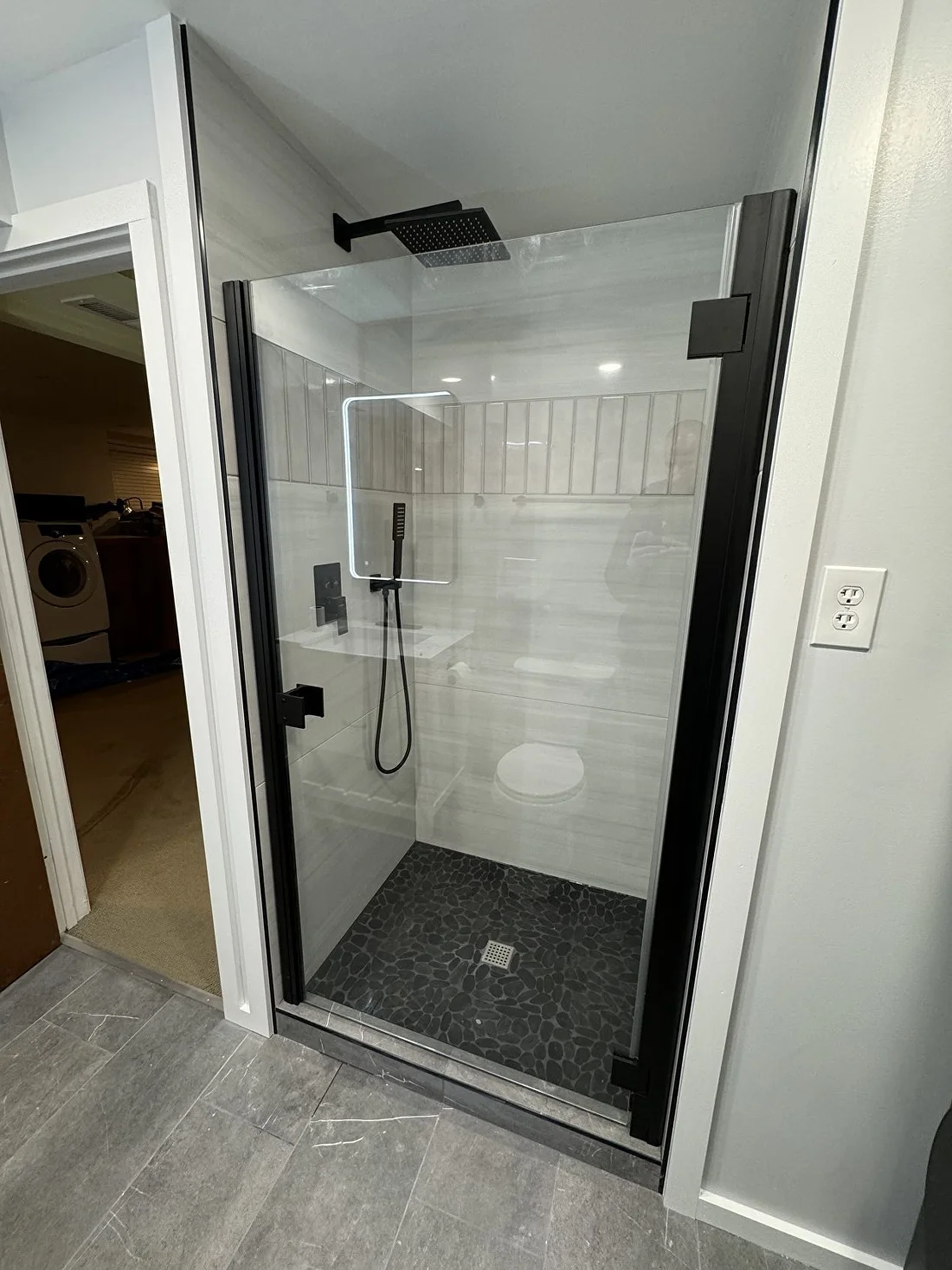 Walk-in shower with matte black frame