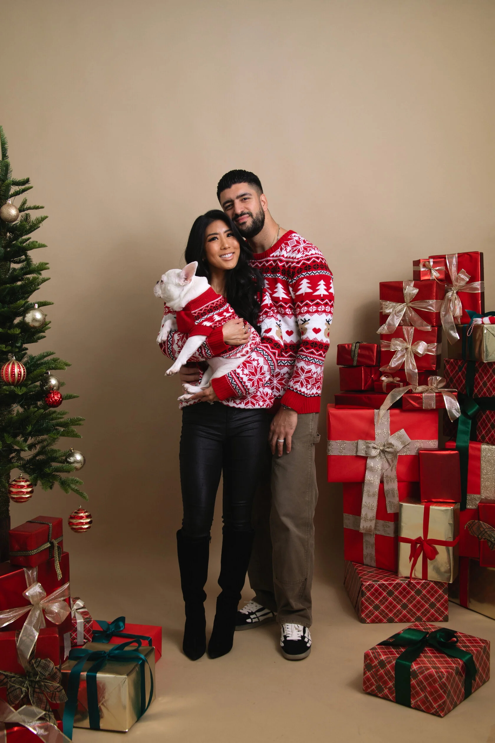 Couple celebrating the holidays during a Christmas photo session at a modern self-portrait studio in San Francisco