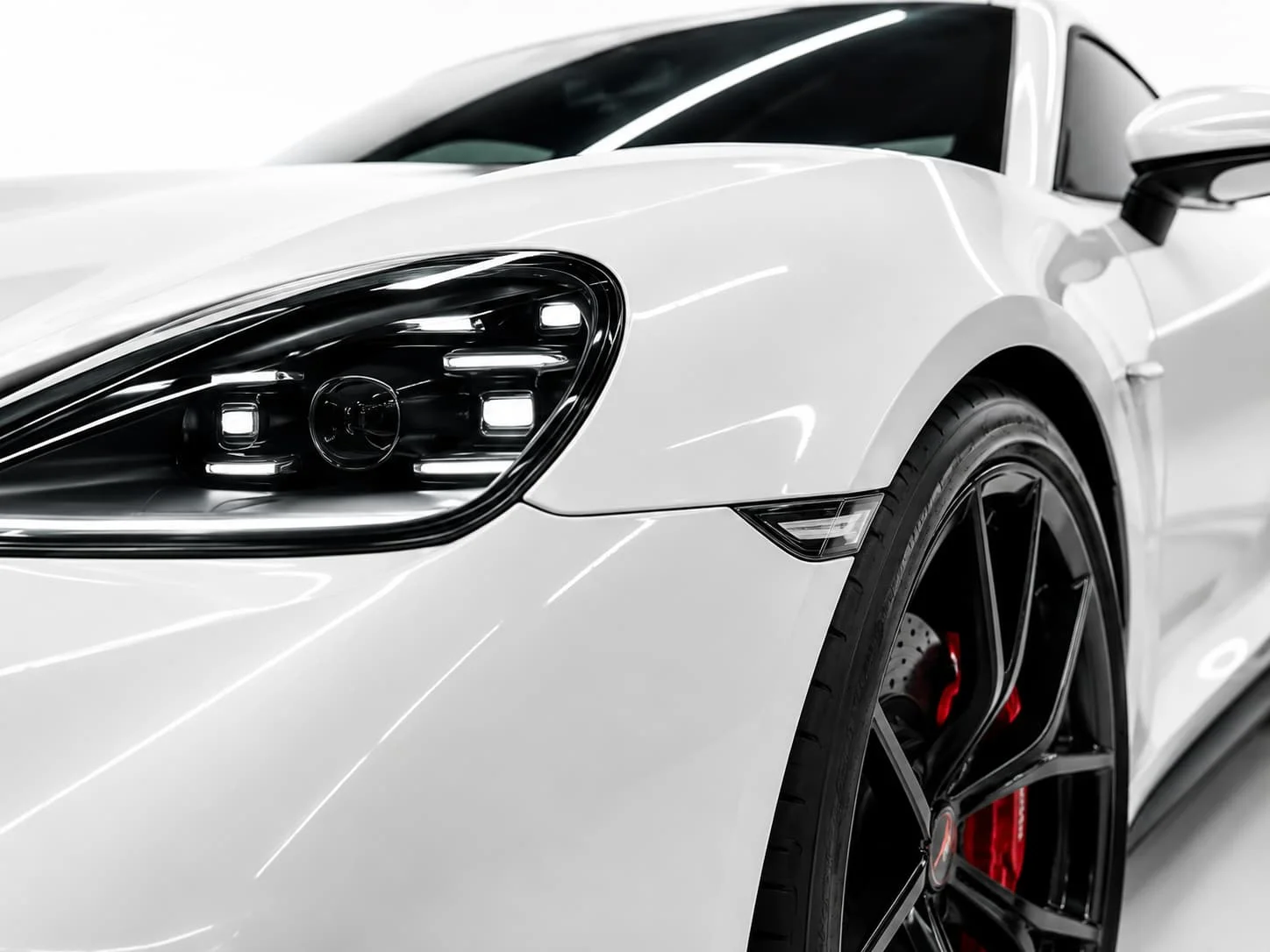White sports car close-up representing paint protection film
