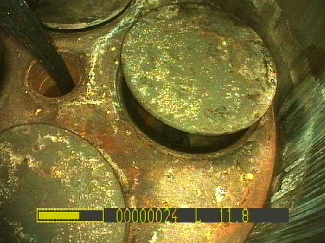 Automotive engine valve seen during a borescope inspection