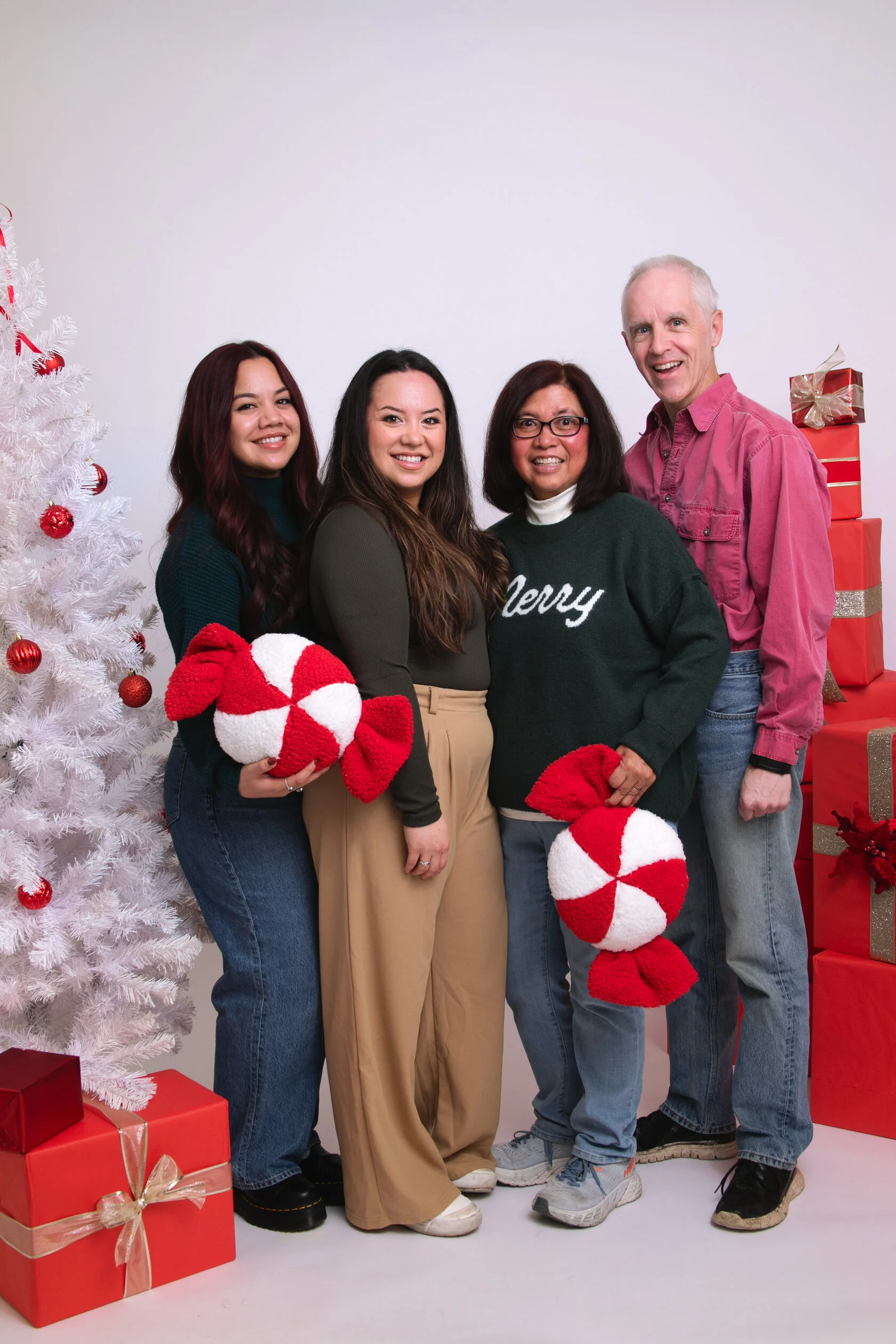 Christmas family photoshoot in a private self-portrait studio in San Francisco with warm holiday decor and cozy lighting