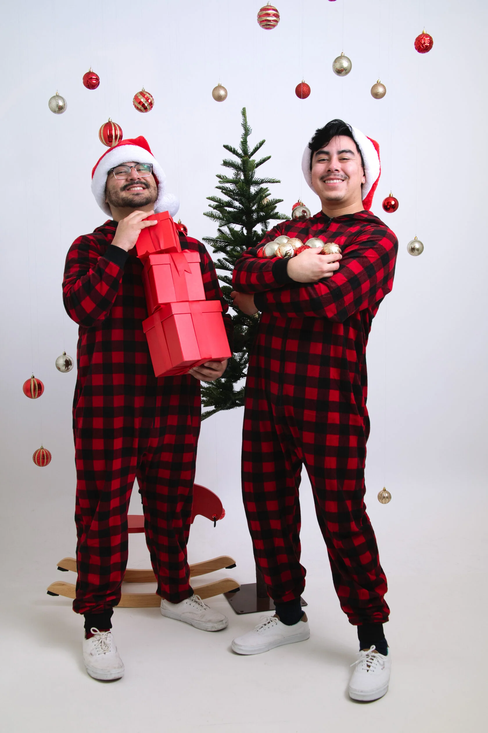 Holiday self-portrait photoshoot with red Christmas gift boxes in a San Francisco studio setting