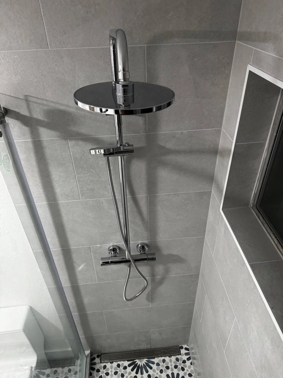 Rain shower system on custom grey tile
